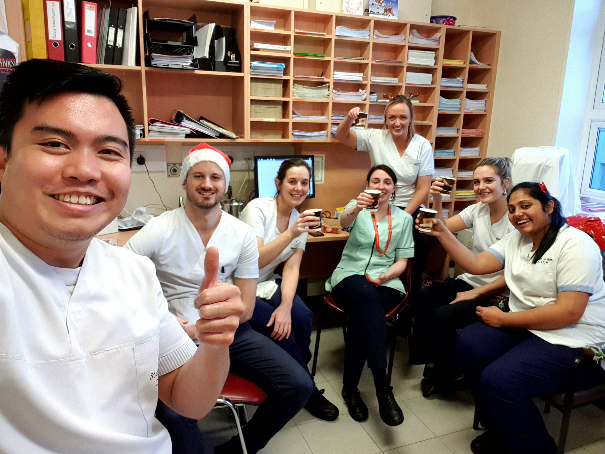 A photograph of Manuel with some of his 
                    Cork University Hospital colleagues at Christmas day.